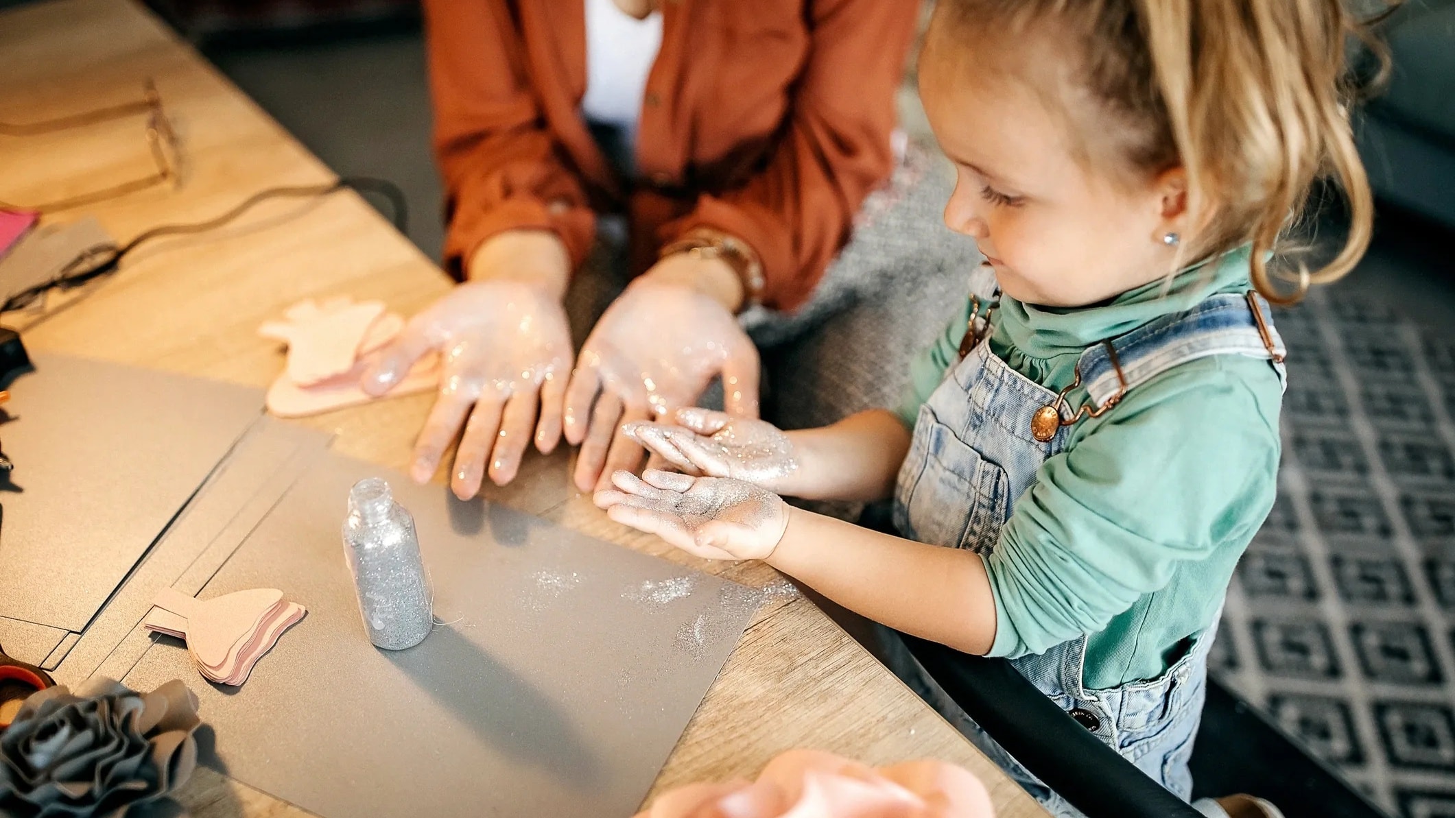 Child learning skills with a caring adult